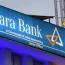 A blue sign with white text that says "Canara Bank A Government of India Undertaking Head Office"
